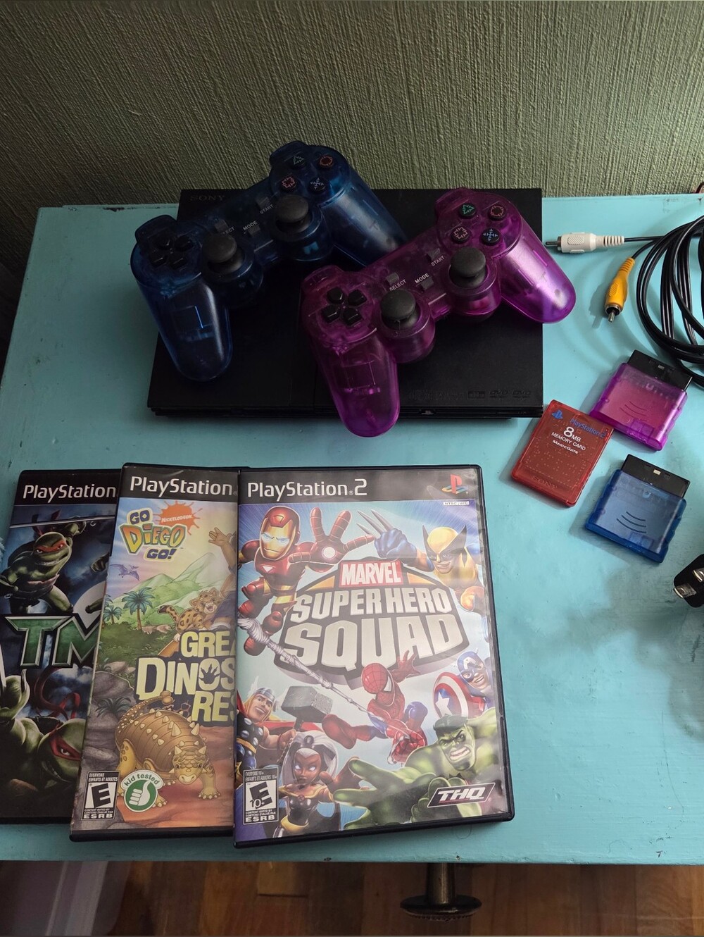 Sony PlayStation 2 Slim with Translucent Blue and Purple Wireless  Controllers